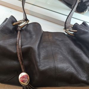 Small brown leather handbag by Furla.